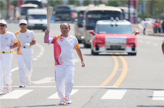 亚运火炬手韦晓青：参与“大莲花”建设，传递火炬一生难忘